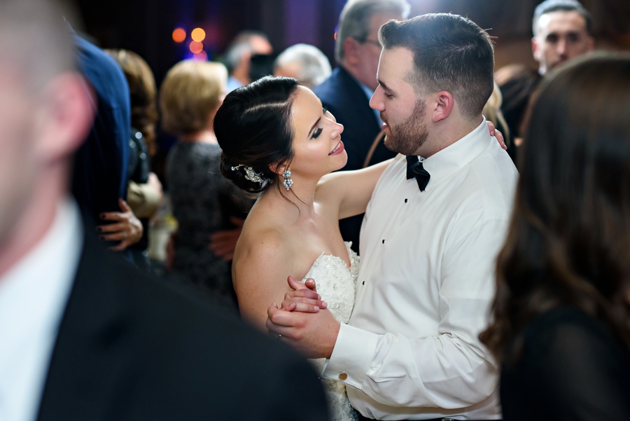 The newly married couple dance the last dance at their wedding reception.